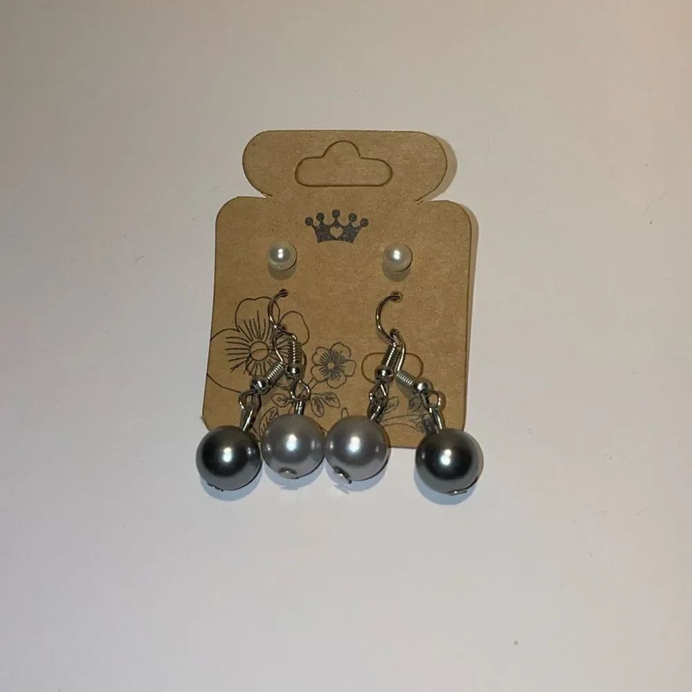 Three sets of faux pearl earrings